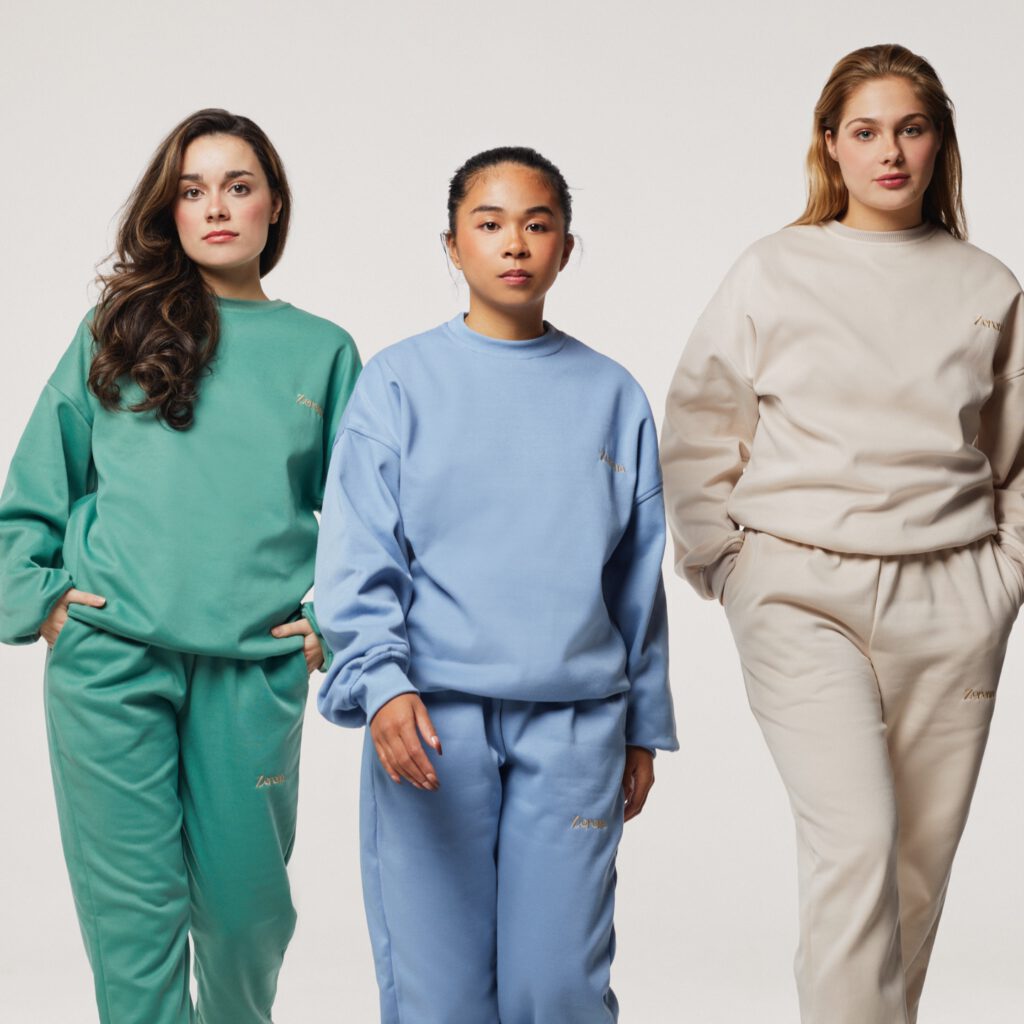 Three woman wearing comfort outfits with the colors green, blue and beige