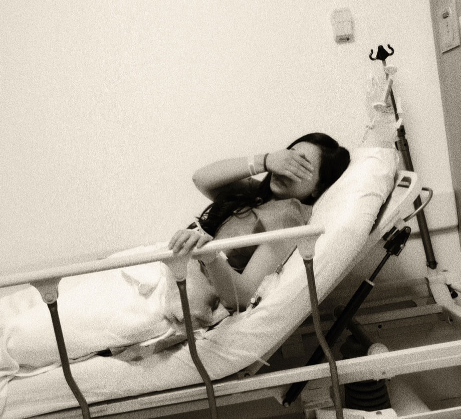 Luisa in a hospital bed